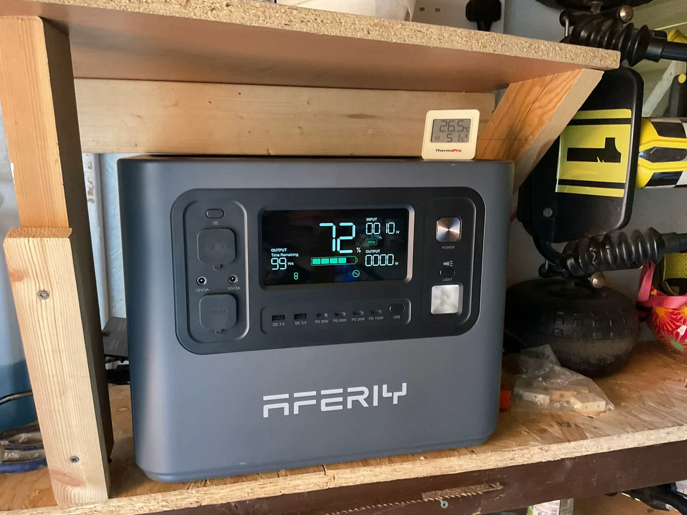 A P210 in the shed powers a washing machine and tumble dryer, one at a time, with reliable solar and AC charging.
